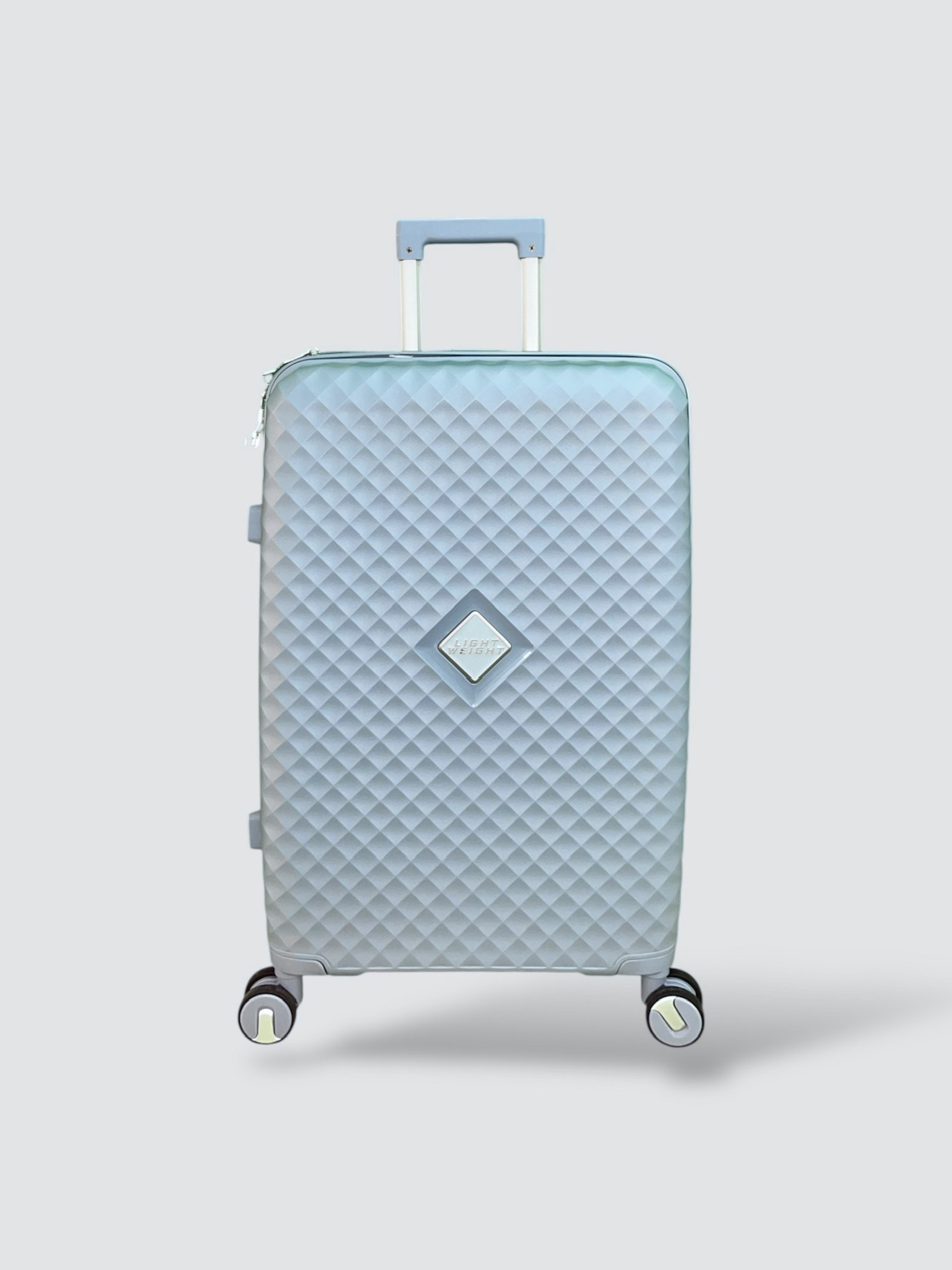 Maleta rígida azul claro con patrón diamante